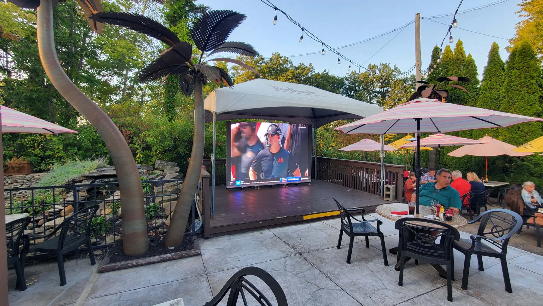 Outdoor patio LED wall rental viewed from a restaurant patio