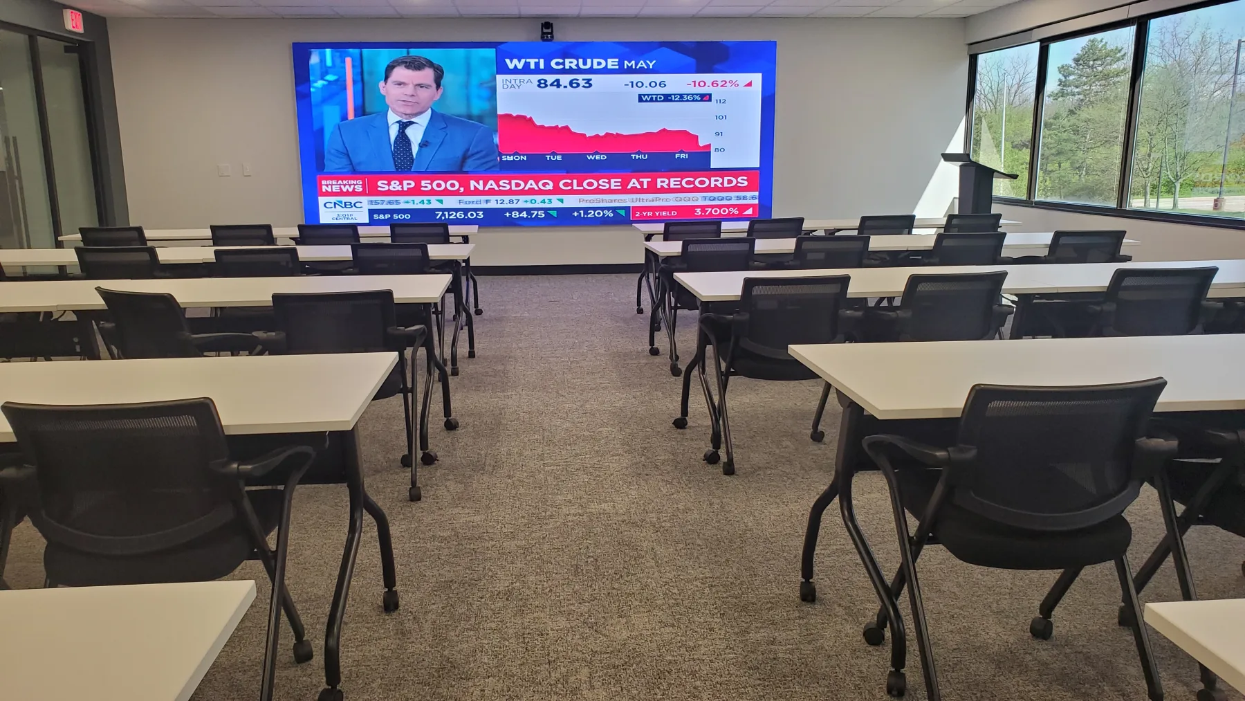 Commercial training room LED wall showing live video content